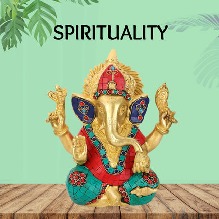 Colorful Ganesh statue with red and teal accents on wooden table, spirituality theme, Shoppiearth UK