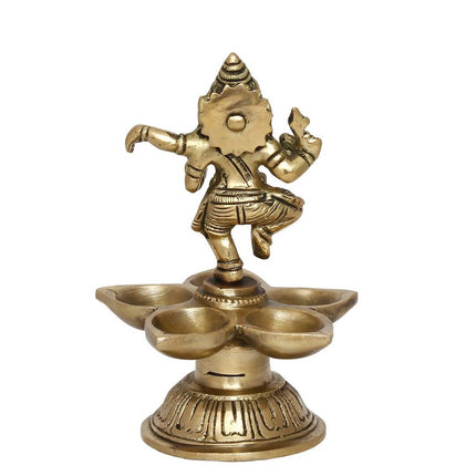 eCraftIndia Gold-Toned Handcrafted Dancing Lord Ganesha Showpiece With Diya