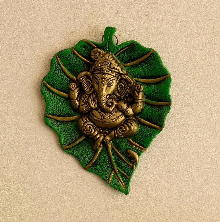 eCraftIndia Metal Golden Lord Ganesha On Green Leaf Wall Hanging Sculpture