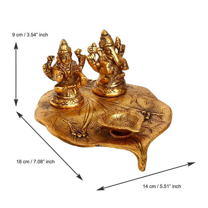 eCraftIndia Antique Gold-Toned Metal Handcrafted Laxmi Ganesh With Diya On Leaf