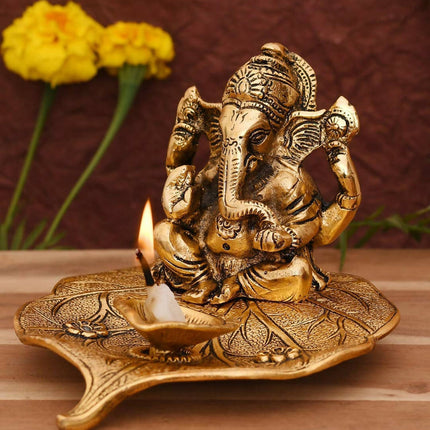 CraftVatika Gold Toned Aluminium Ganesh with Diya Idol